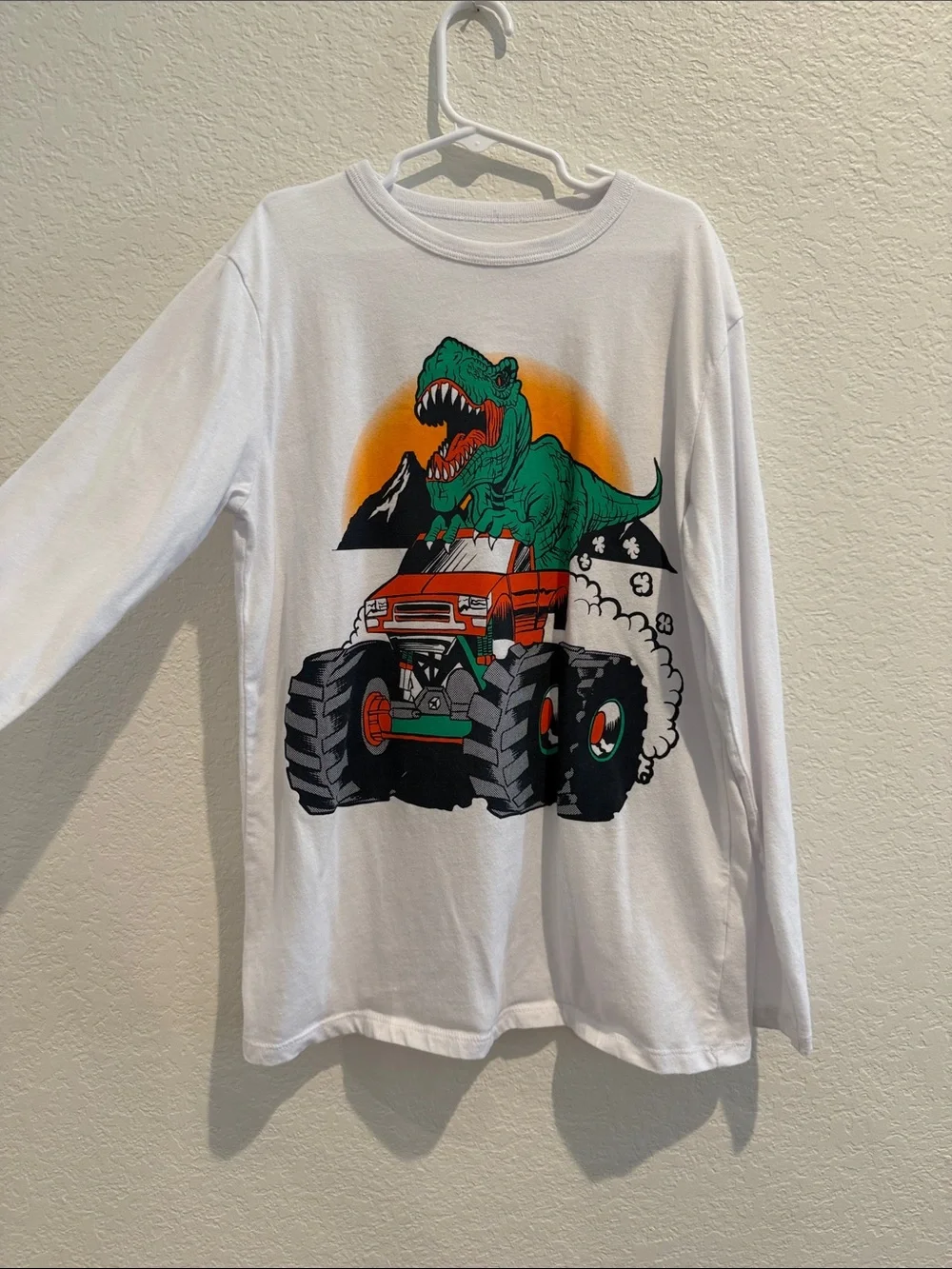White Long-Sleeve Kids Tee with Green Dinosaur & Orange Monster Truck